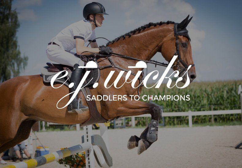 A man is riding a brown horse with the words e.j. wicks saddlers to champions on the bottom