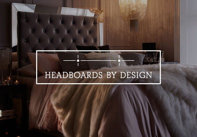 A bedroom with a bed and a sign that says headboards by design