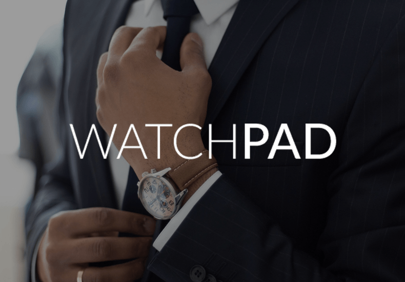 A man in a suit and tie is adjusting his tie in front of a watchpad logo