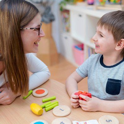 Child Care — Woman Talking To A Kid In Stratford, NJ