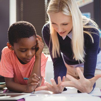 Math Program — A Woman Helping A Kid To Count In Stratford, NJ