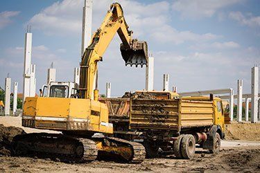 Truck Loader Excavator — Jefferson City, MO — Bill Binkley & Sons Excavating Truck Loader Excavator — Jefferson City, MO — Bill Binkley & Sons Excavating