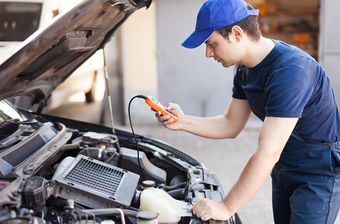 Mechanic Checking Car Diagnostics — Brake Repairs in Palmerston, NT Mechanic Checking Car Diagnostics — Brake Repairs in Palmerston, NT