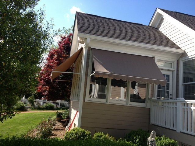 Retractable Awning Installation Professionals — Brown Retractable Awning in Spartanburg, SC