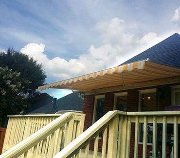 Awnings Spartanburg — Retractable Striped Awning in Spartanburg, SC Awnings Spartanburg — Retractable Striped Awning in Spartanburg, SC