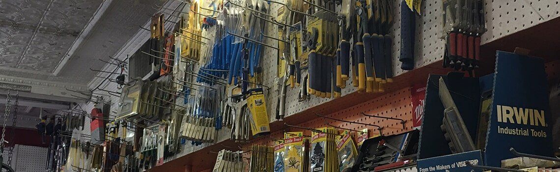 Tools displayed on a shelf in a hardware store.