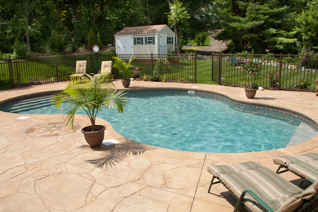 This is a picture of a concrete pool deck.  The concrete is stamped concrete.