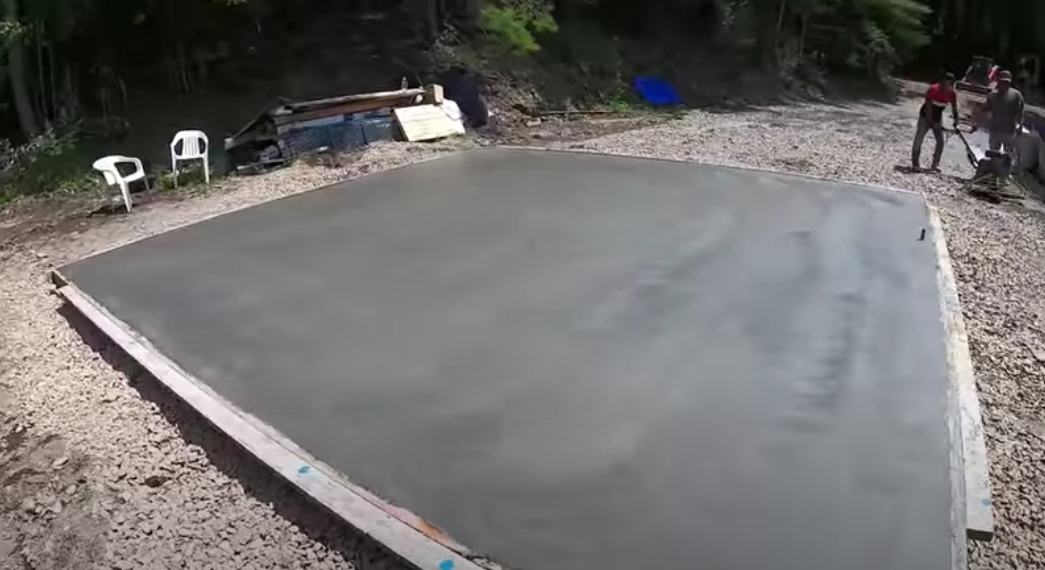 Picture of a concrete slab on grade.  The slab will be the base for a shed or garage.