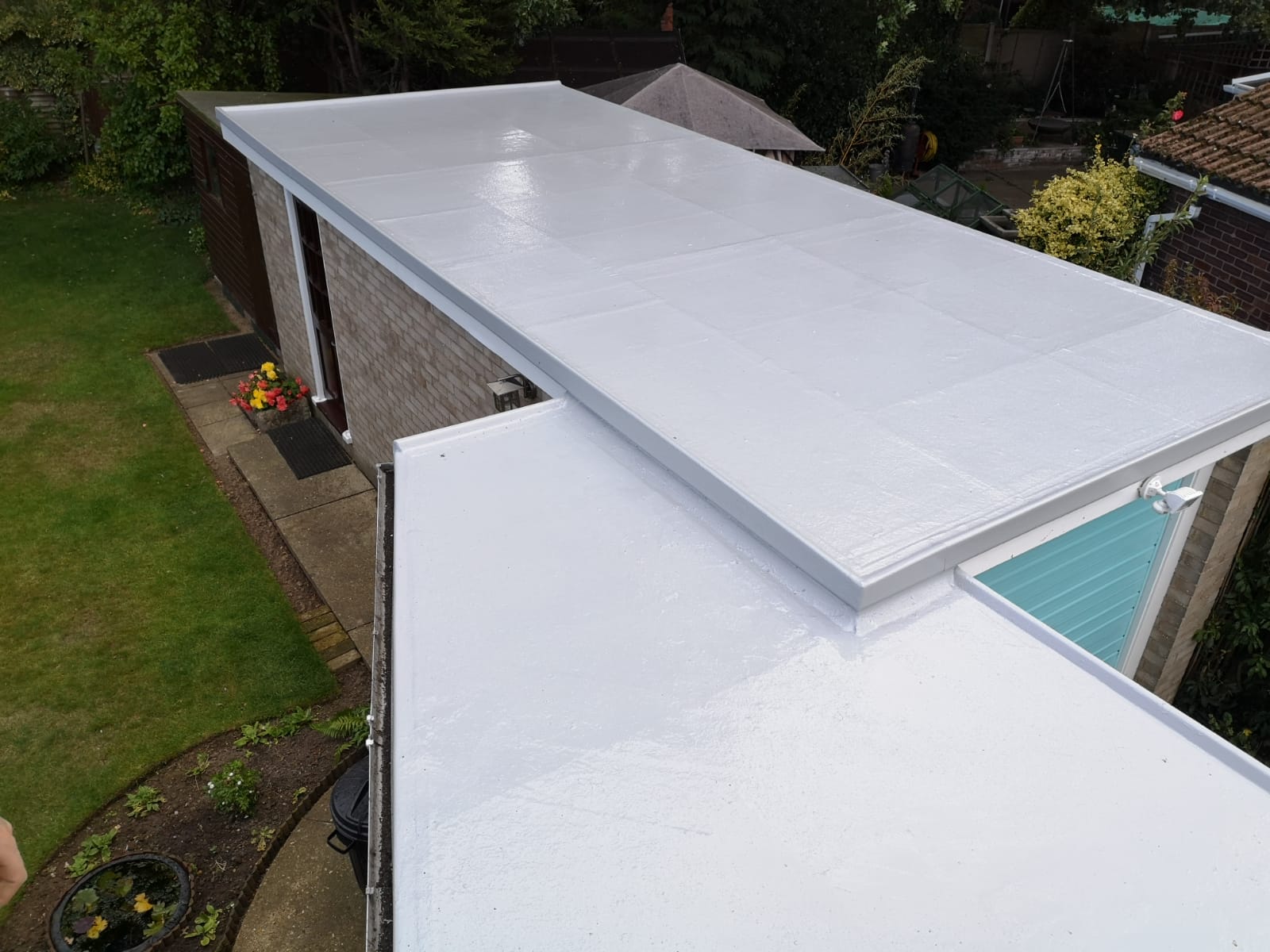 the roof of a house has been painted white