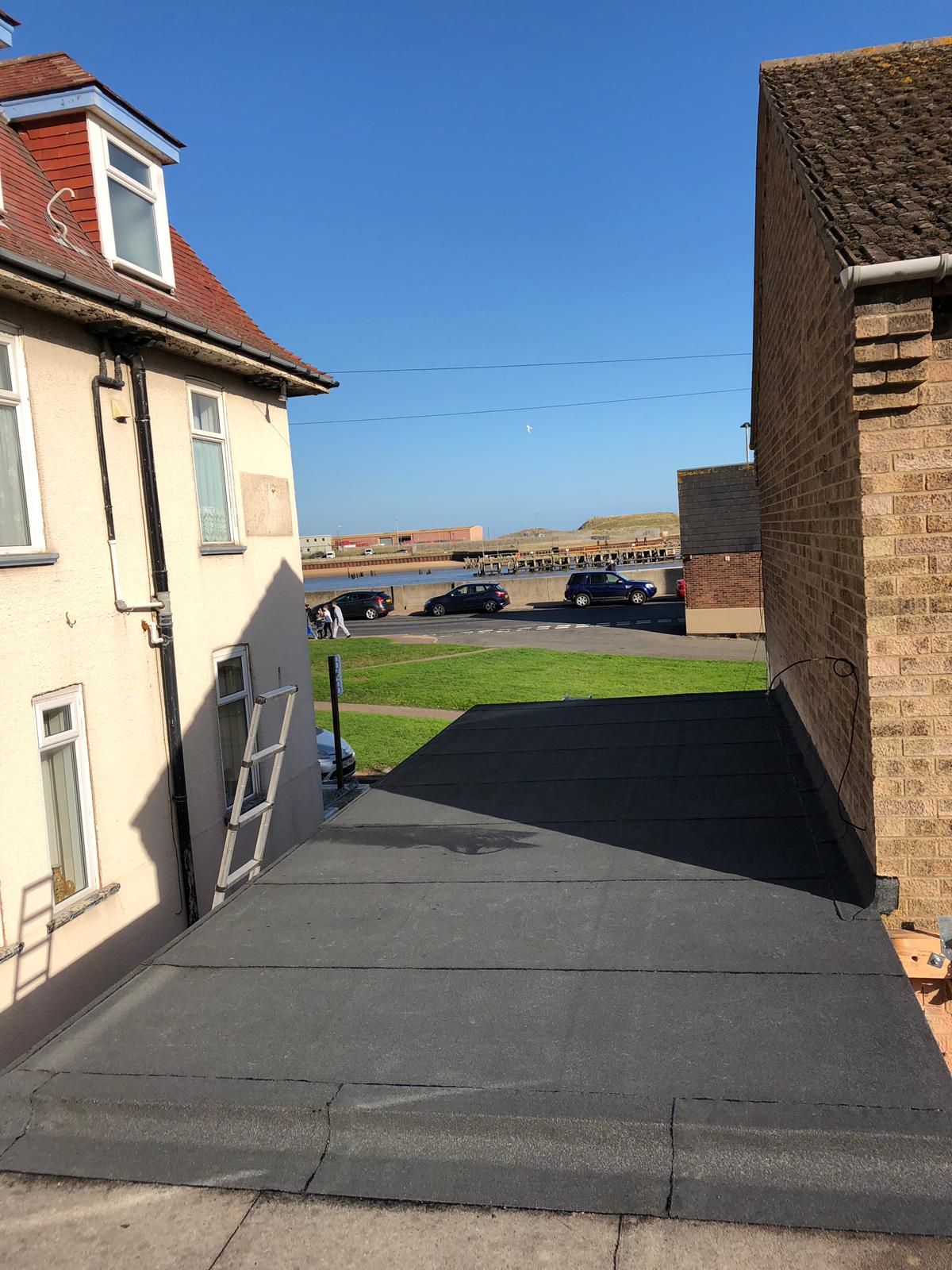 a house with a ladder on the side of it