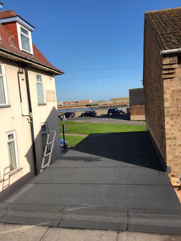 a house with a ladder on the side of it