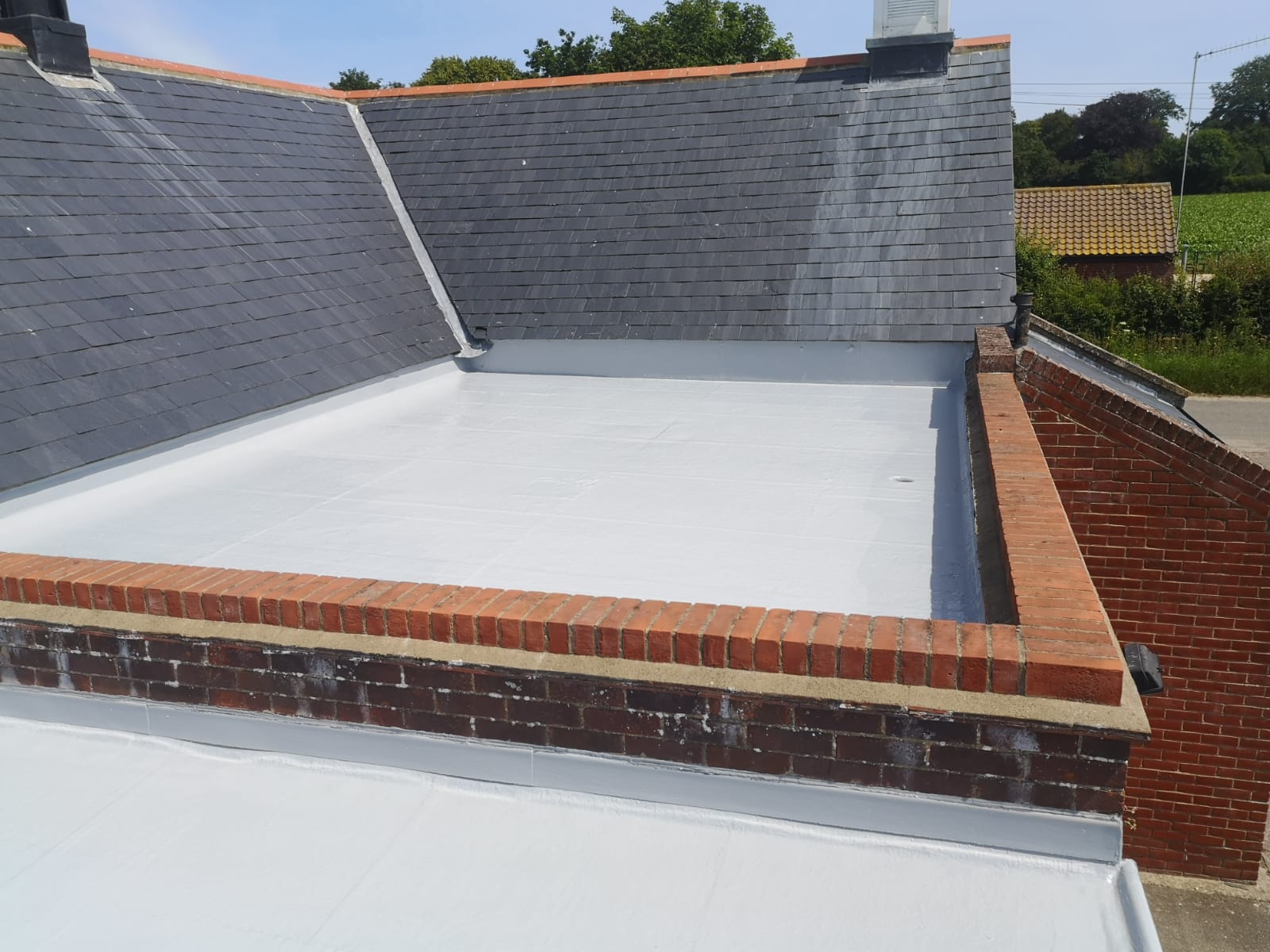 a roof with slate tiles and a white roof