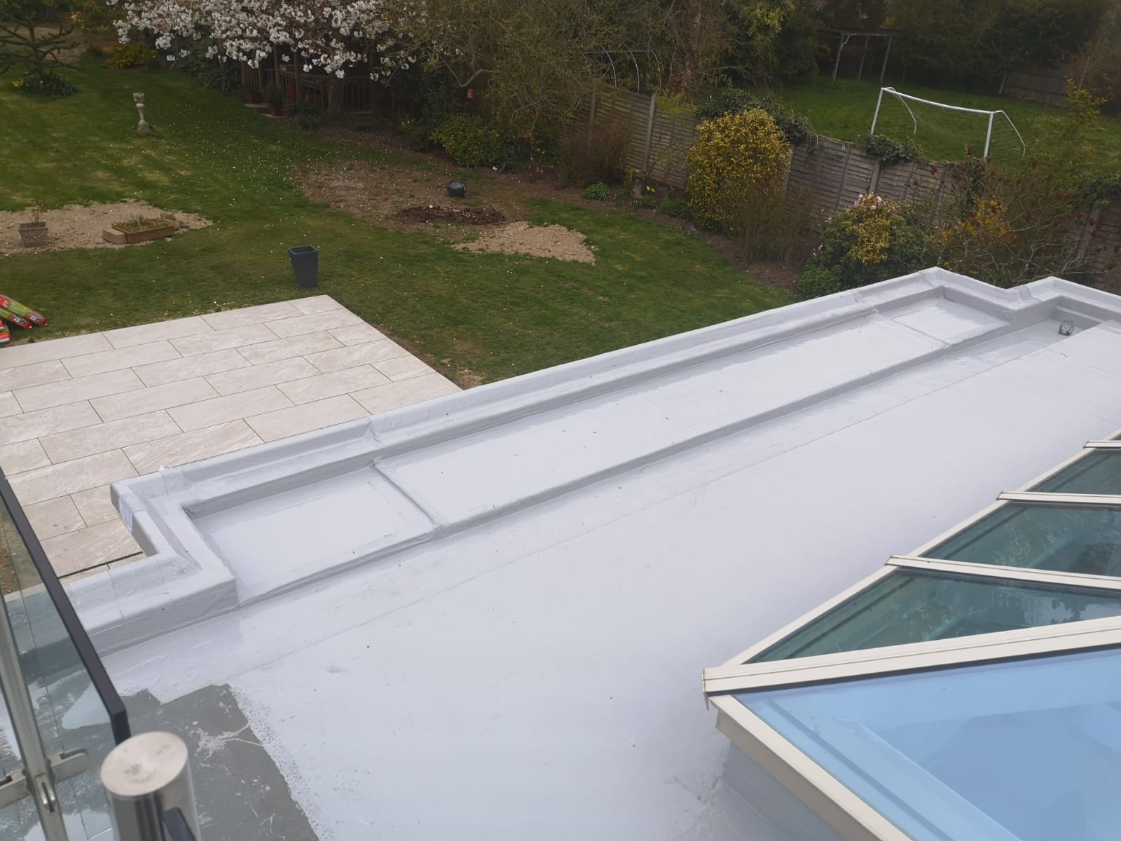 a white roof with a skylight on top of it