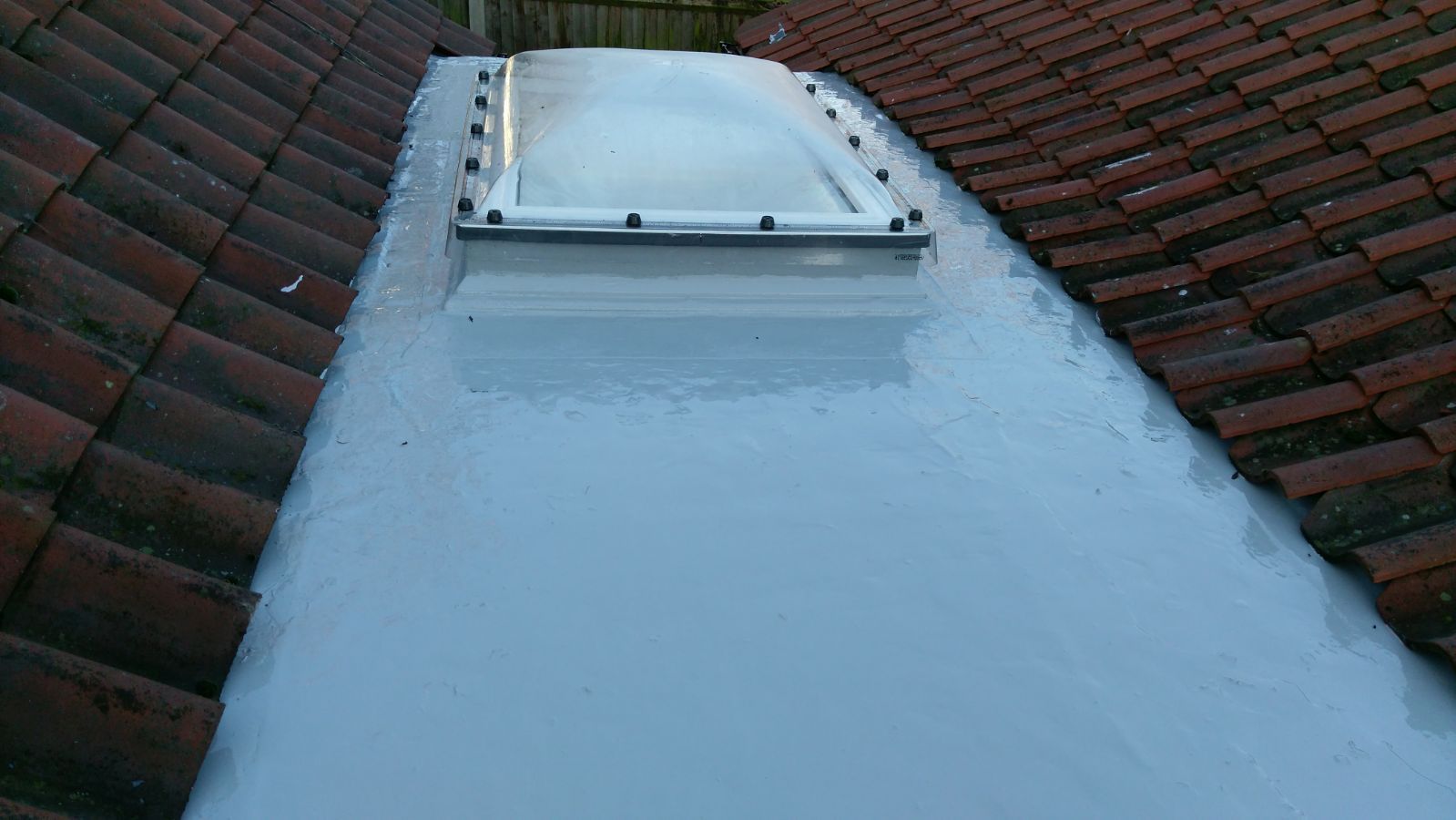 a roof with a skylight on top of it