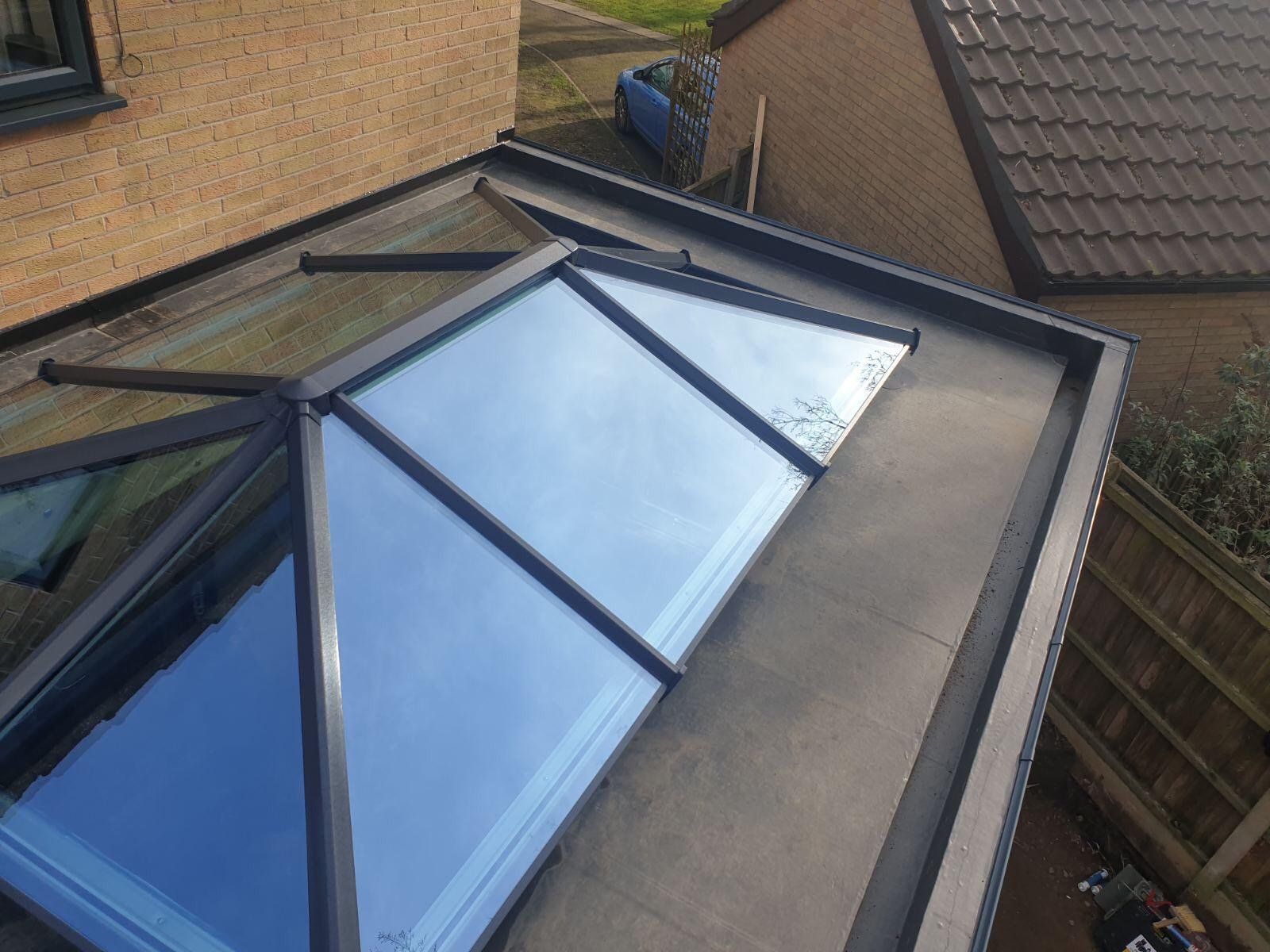 a roof with a skylight on top of it