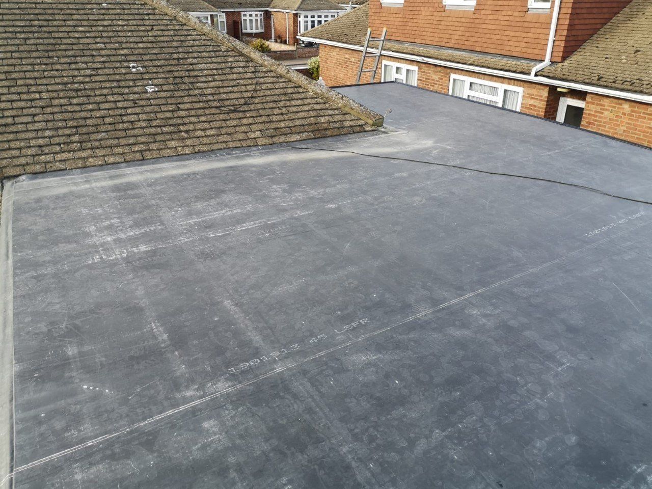the roof of a house with a ladder on it