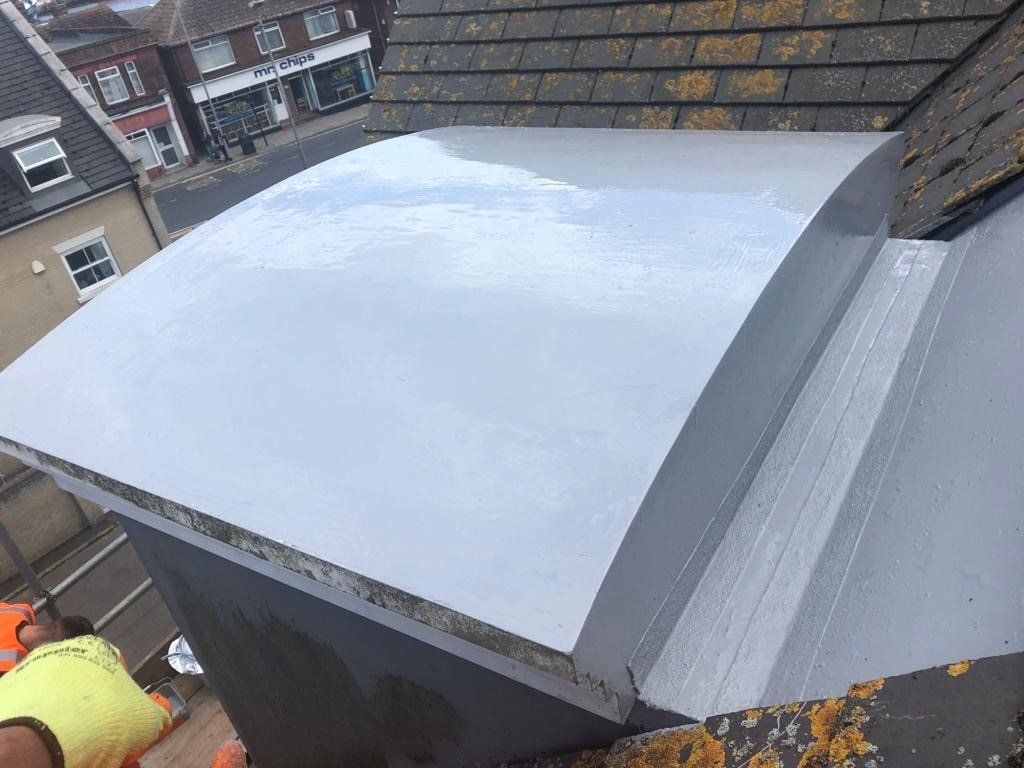 a rooftop with a white roof and a white sign that says mrs crisps