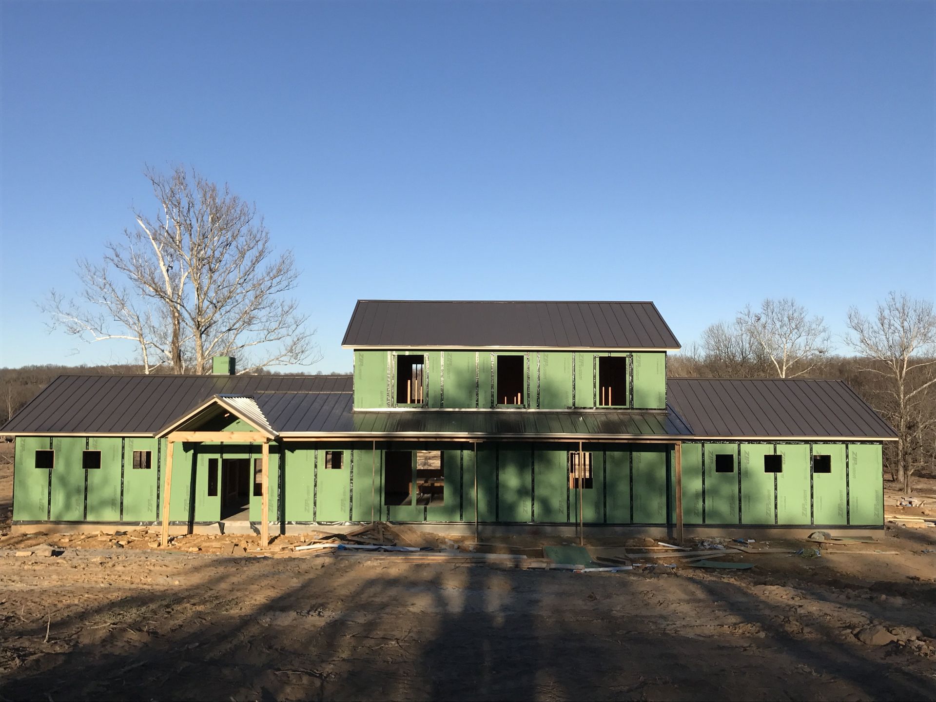 Roofer installing roofing systems tile in Jenks, OK