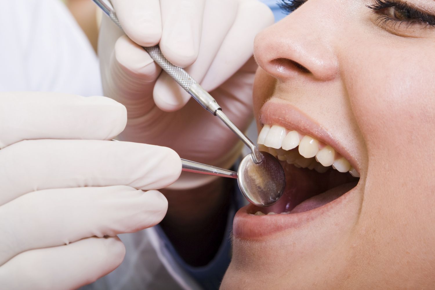 Woman having a check up at your dental practice in Rochester, NY