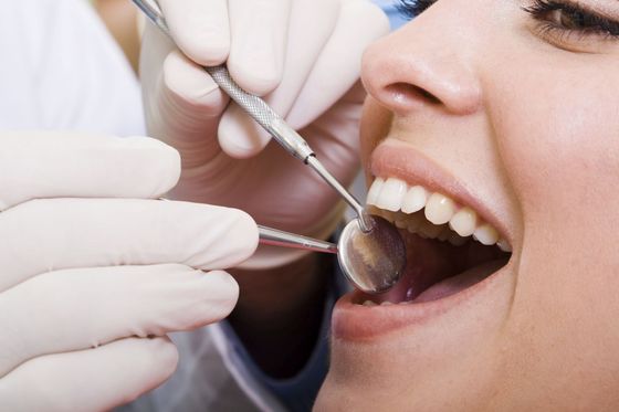 Woman having a check up at your dental practice in Rochester, NY