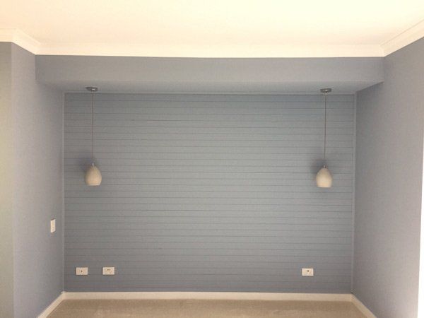 grey wall with hanging lights