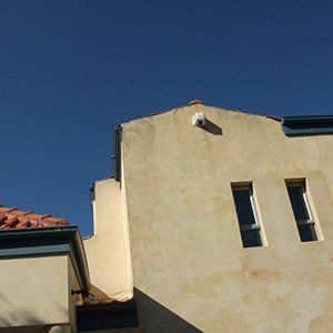 exterior of dirty white building