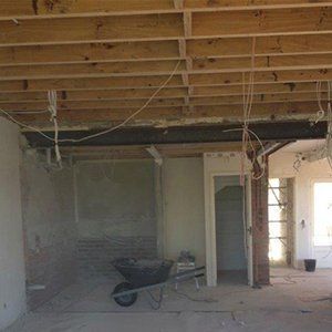 unfinished room with wheelbarrow