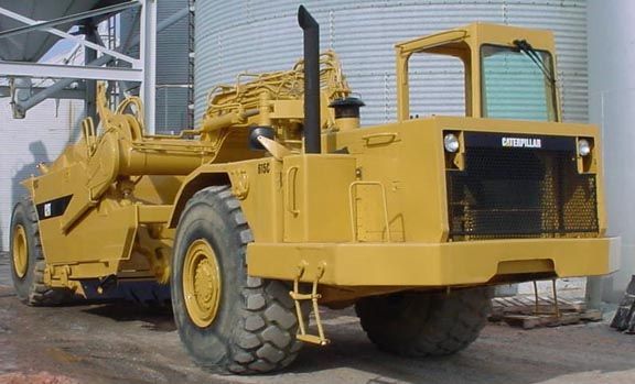 Yellow Caterpillar wheel loader outdoors.