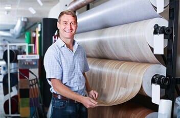 Waterproof — Man Choosing Bolt of Linoleum in Staten Island, NY