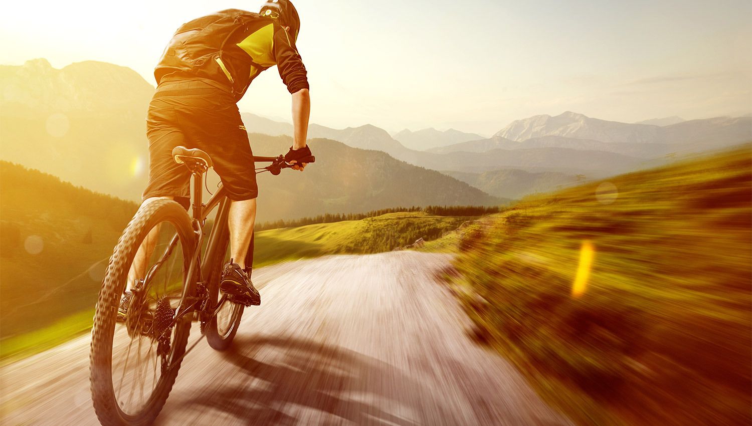 a man riding is bike