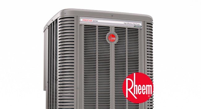 Gray Rheem air conditioning unit with red Rheem logo.