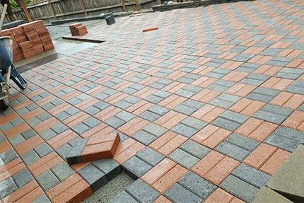 Brick — Brick Backyard Laying Down Flooring Pieces In Everett, WA Brick — Brick Backyard Laying Down Flooring Pieces In Everett, WA