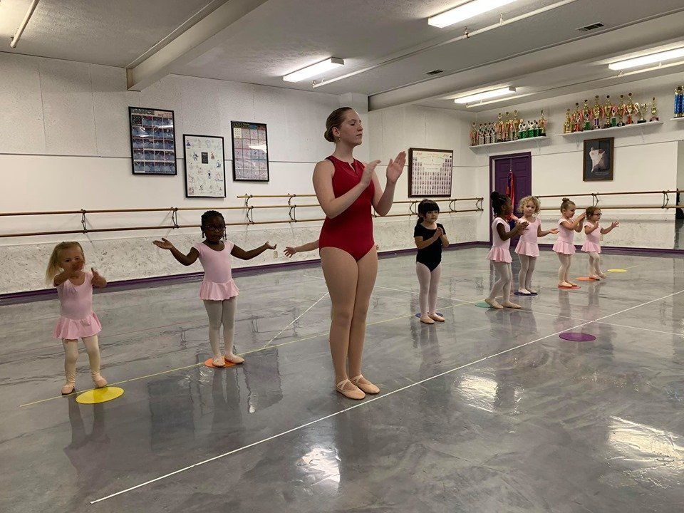 young students learning to dance