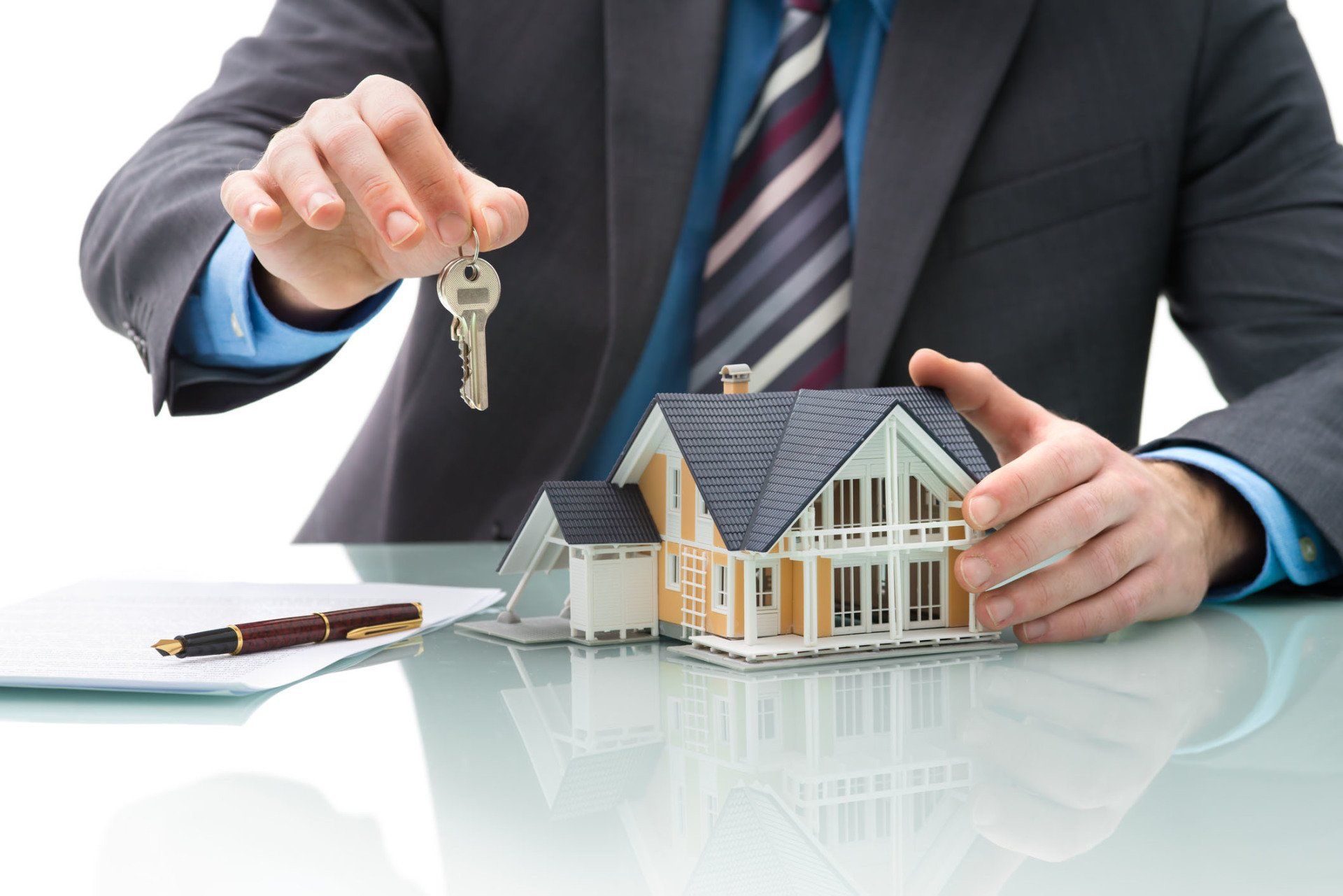 Notary Public — Man holding a key and house in Bethlehem, PA Notary Public — Man holding a key and house in Bethlehem, PA