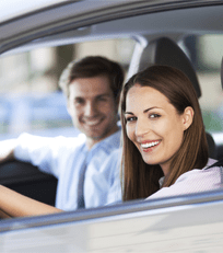 Man and Woman on Car - Insurance Deal in Greenville, OH Man and Woman on Car - Insurance Deal in Greenville, OH