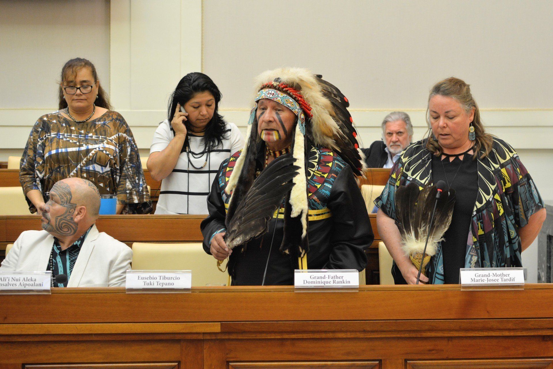 Ethics in Action and Indigenous Peoples SDGs: A group of people attending a meeting. 