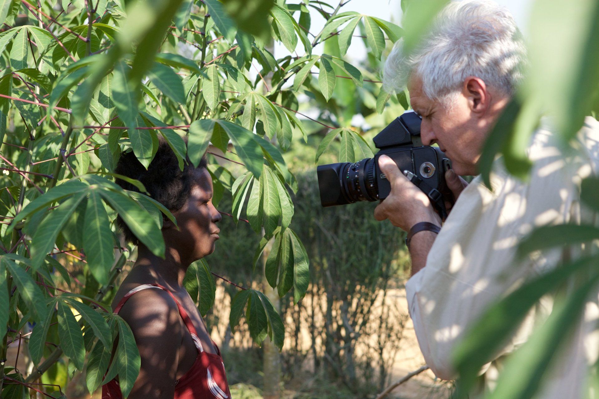 Photographer captures documentary scenes amidst Rwanda’s greenery for Millennium Villages Project.