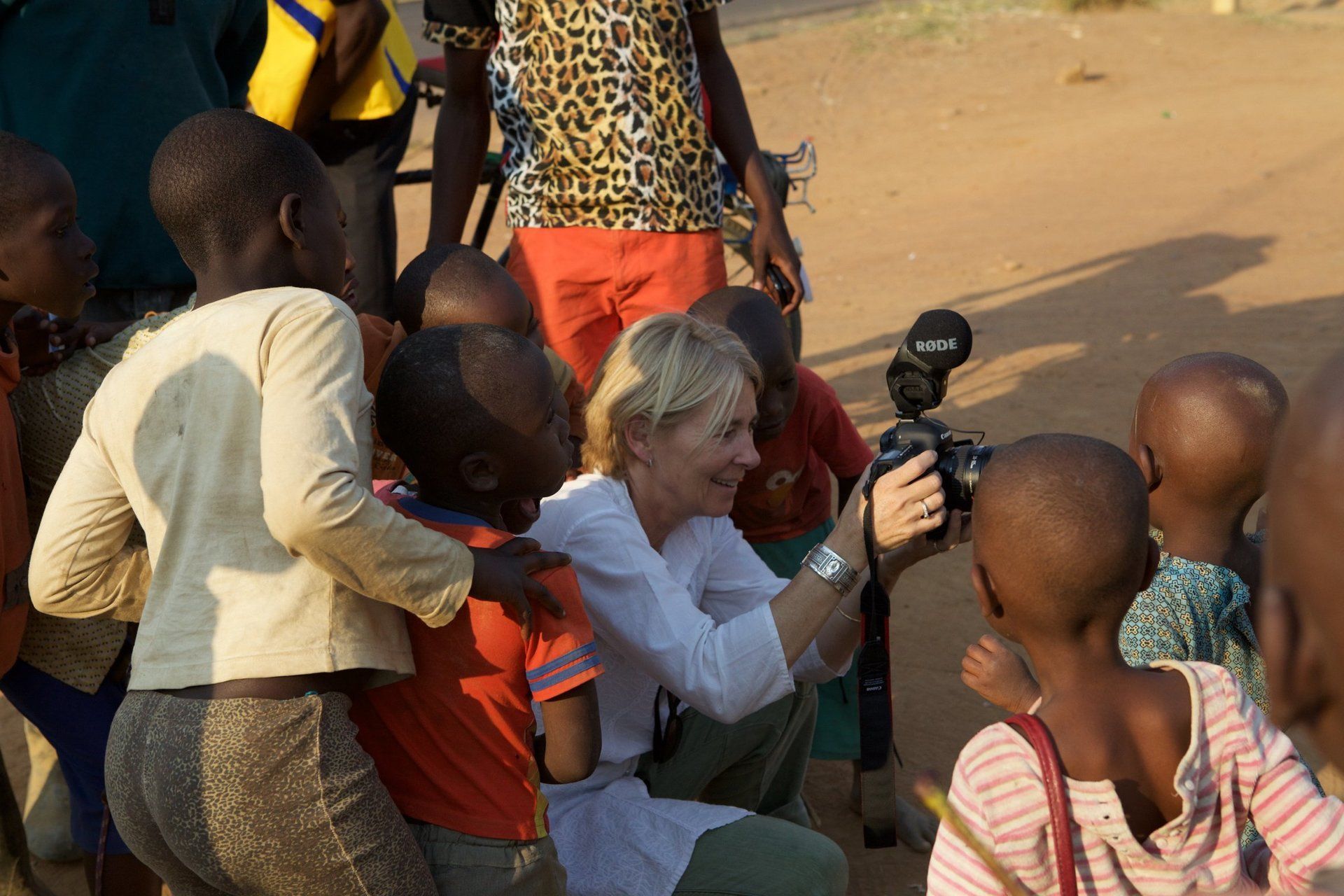 Documentary filming with local children and adults in Mayange, Rwanda for Millennium Villages Project.