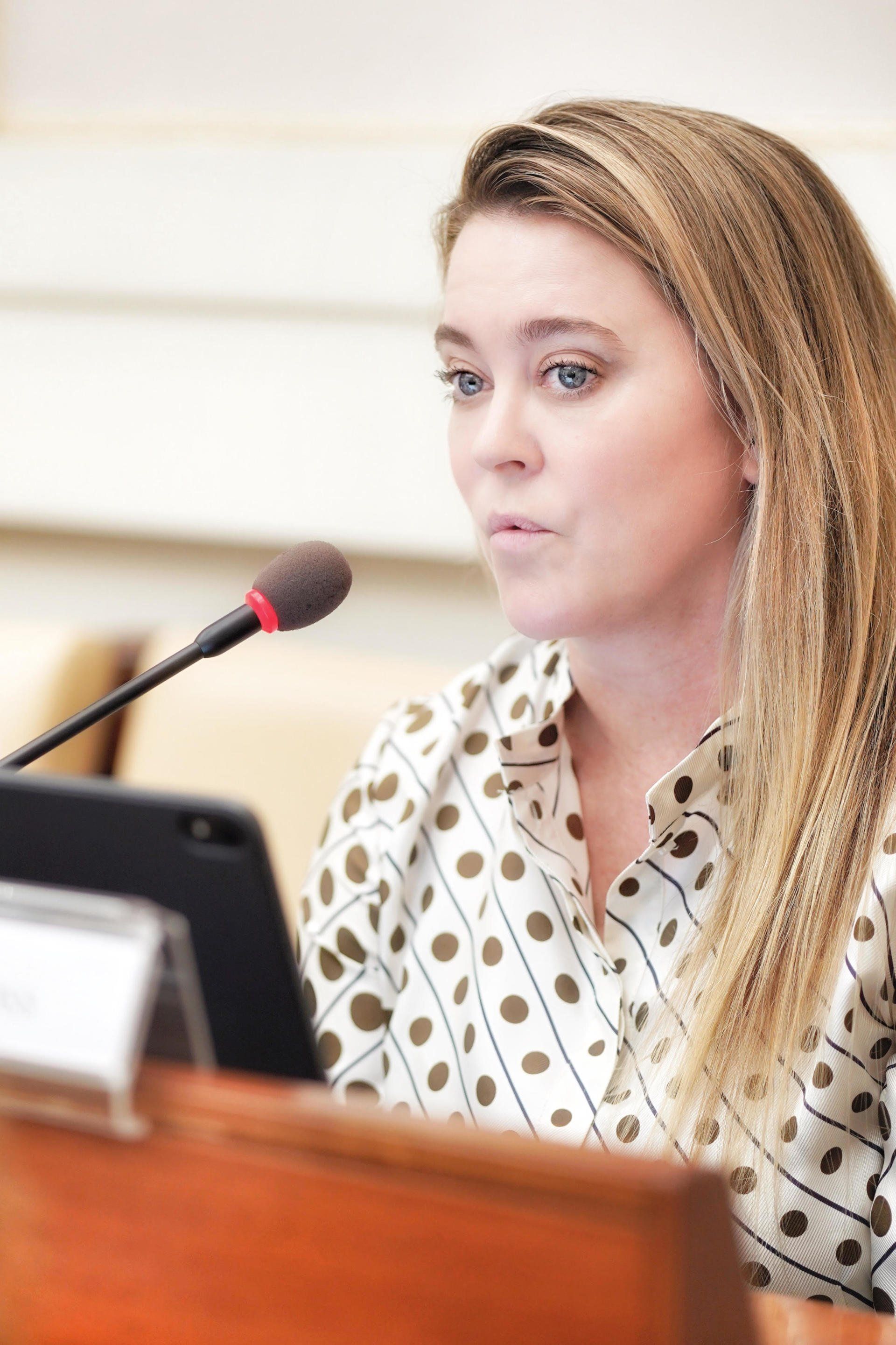 Jennifer Gross talking into a mic