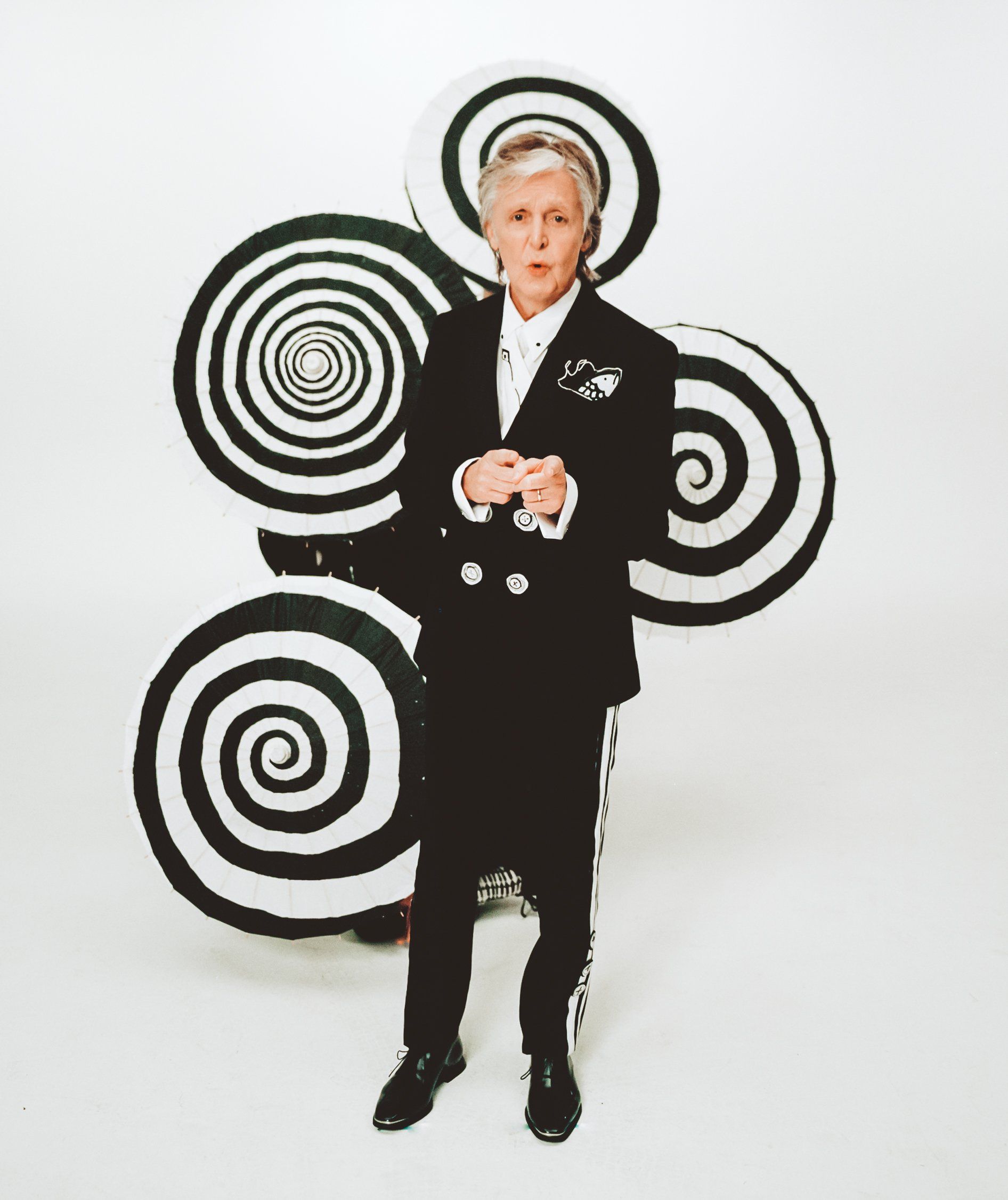 Paul McCartney #WhoCaresIDo Who Cares I Do Campaign, Paul McCartney standing in front of a black and white swirly statue