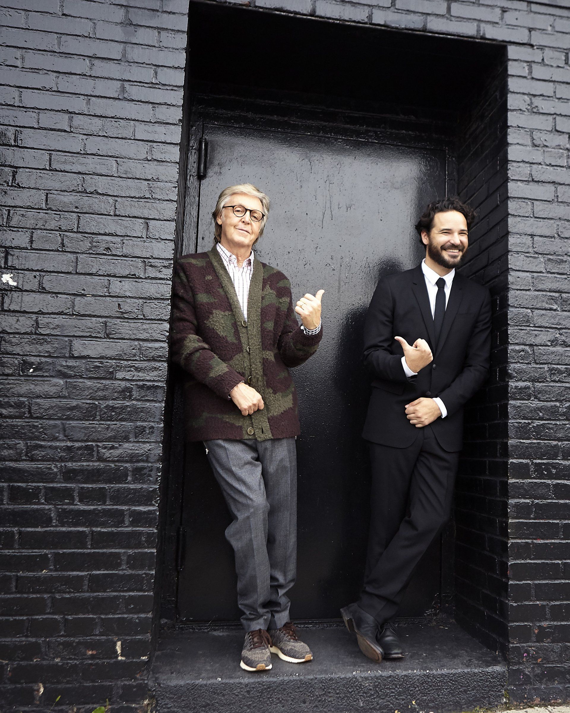 Who care I do, Paul McCartney and a man in a black suit standing in a door way