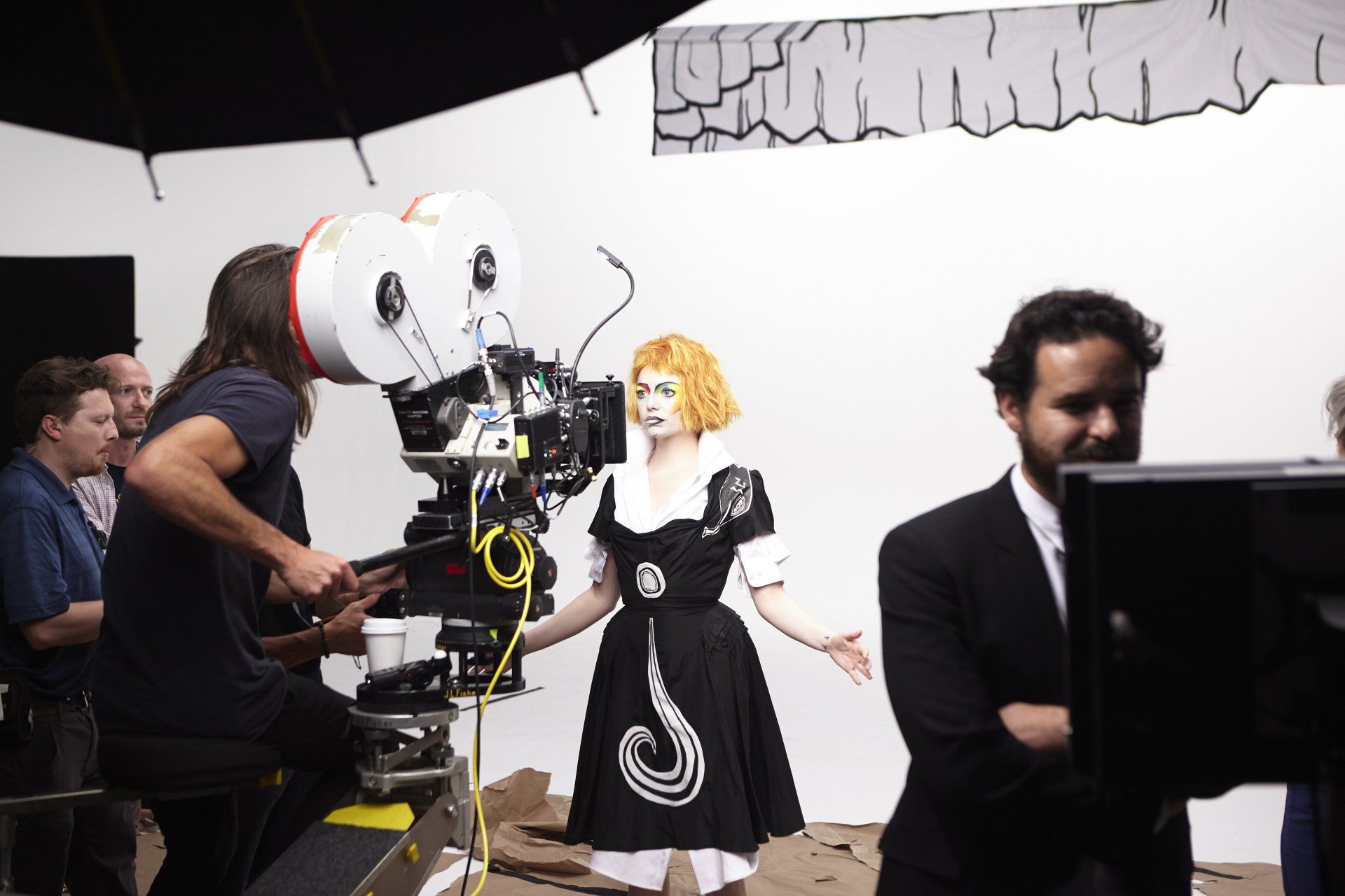Filling during the Who cares production, Emma Stone looking into the camera