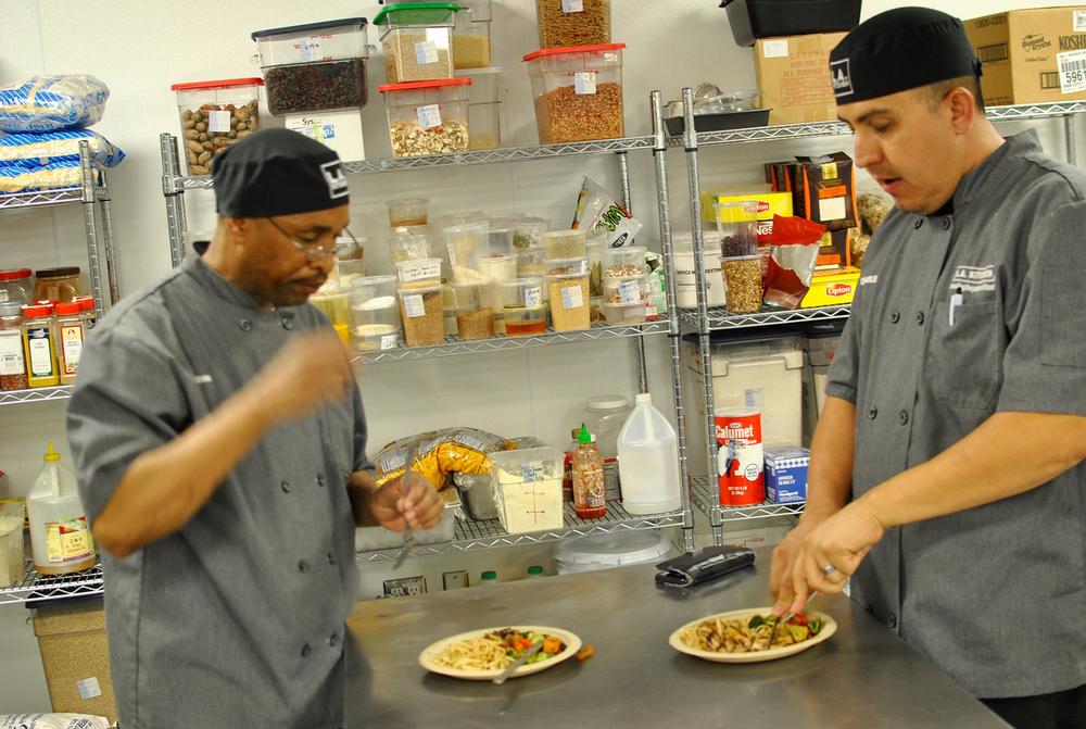 LA Kitchen a  sustainable social enterprise organization students tasting their dinner creations