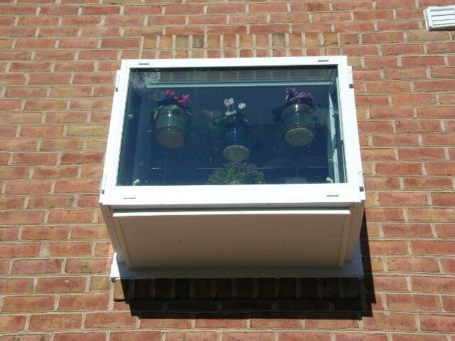 Window With Plants — Baldwin, MD — J.W. Calvert MFG.