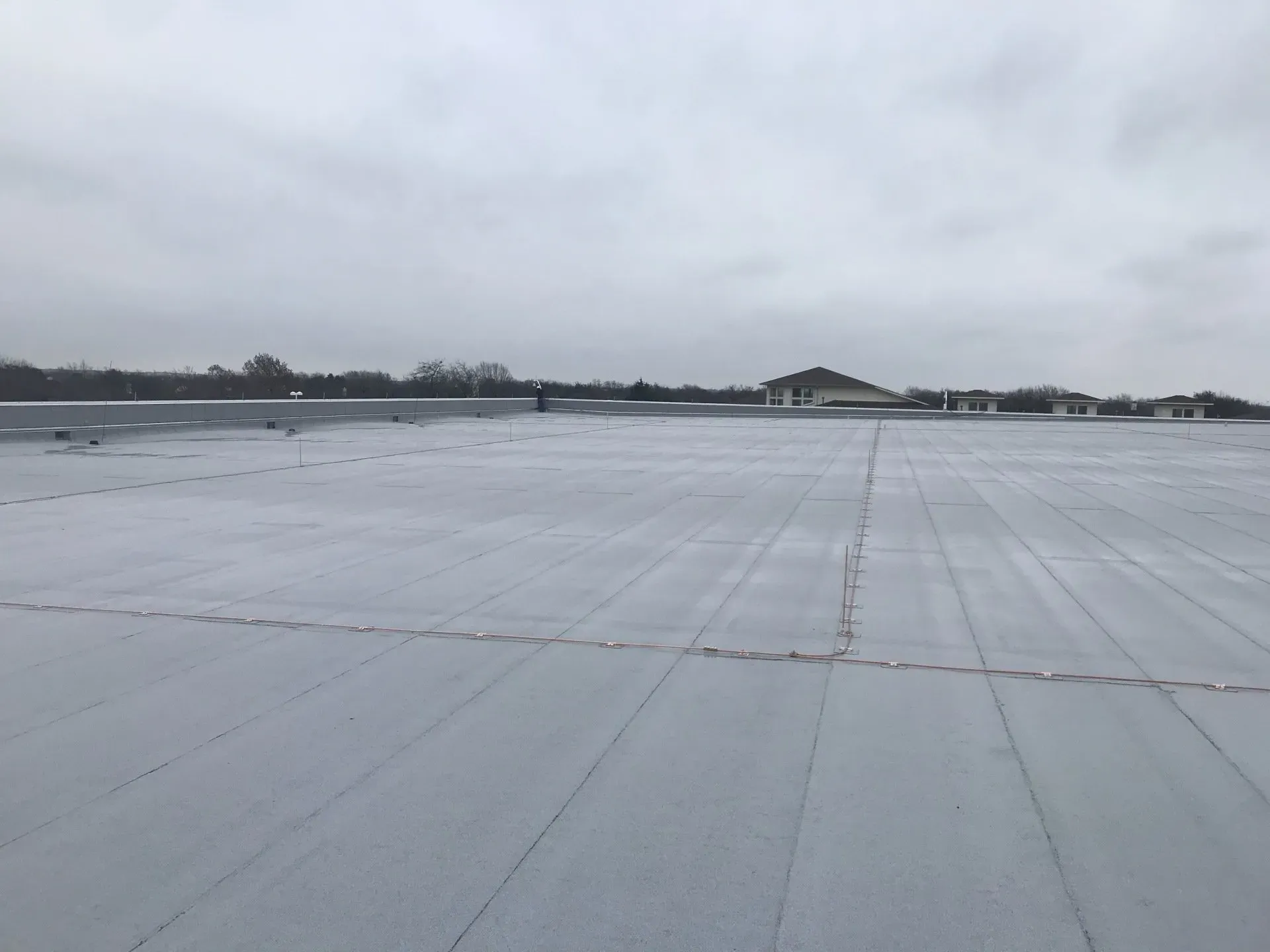 A large white roof with a lot of snow on it