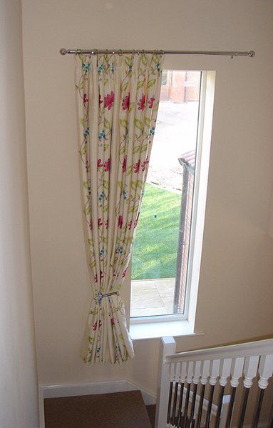 Multi couloured floral fabric pencil pleat curtain