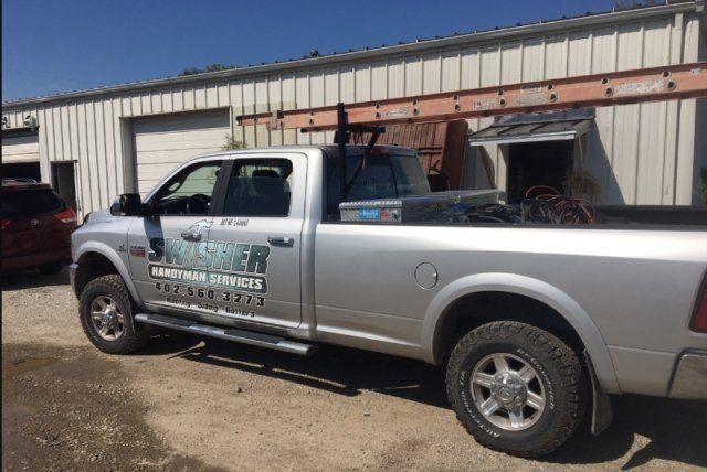 Swisher Handyman Services truck at the construction site