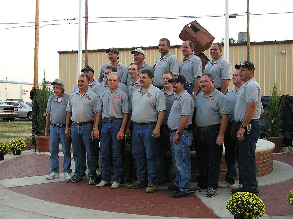 A group photo op of the Anthony Fire Department in front of the 9-11 Memorial.