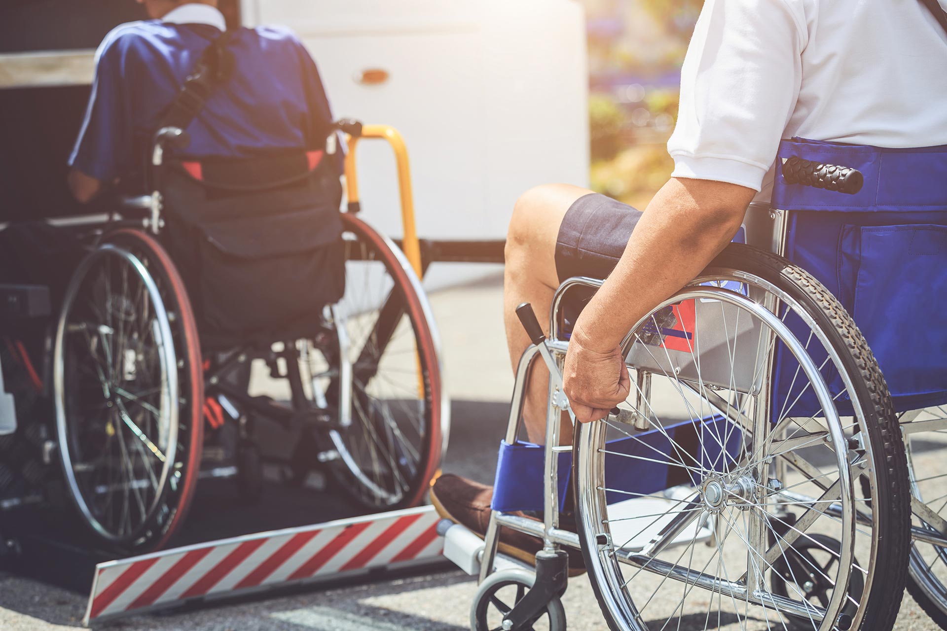 disabled people on wheelchair boarding a bus
