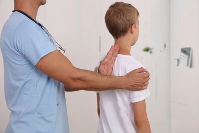 Young Boy Having Back Adjustment — Robstown, TX — Five Points Chiropractic Clinic Young Boy Having Back Adjustment — Robstown, TX — Five Points Chiropractic Clinic